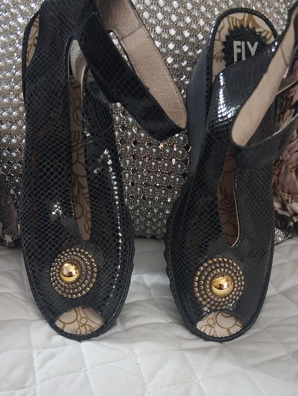 Fly London Black Snake-Texture Peep-Toe Wedges with Gold Medallion